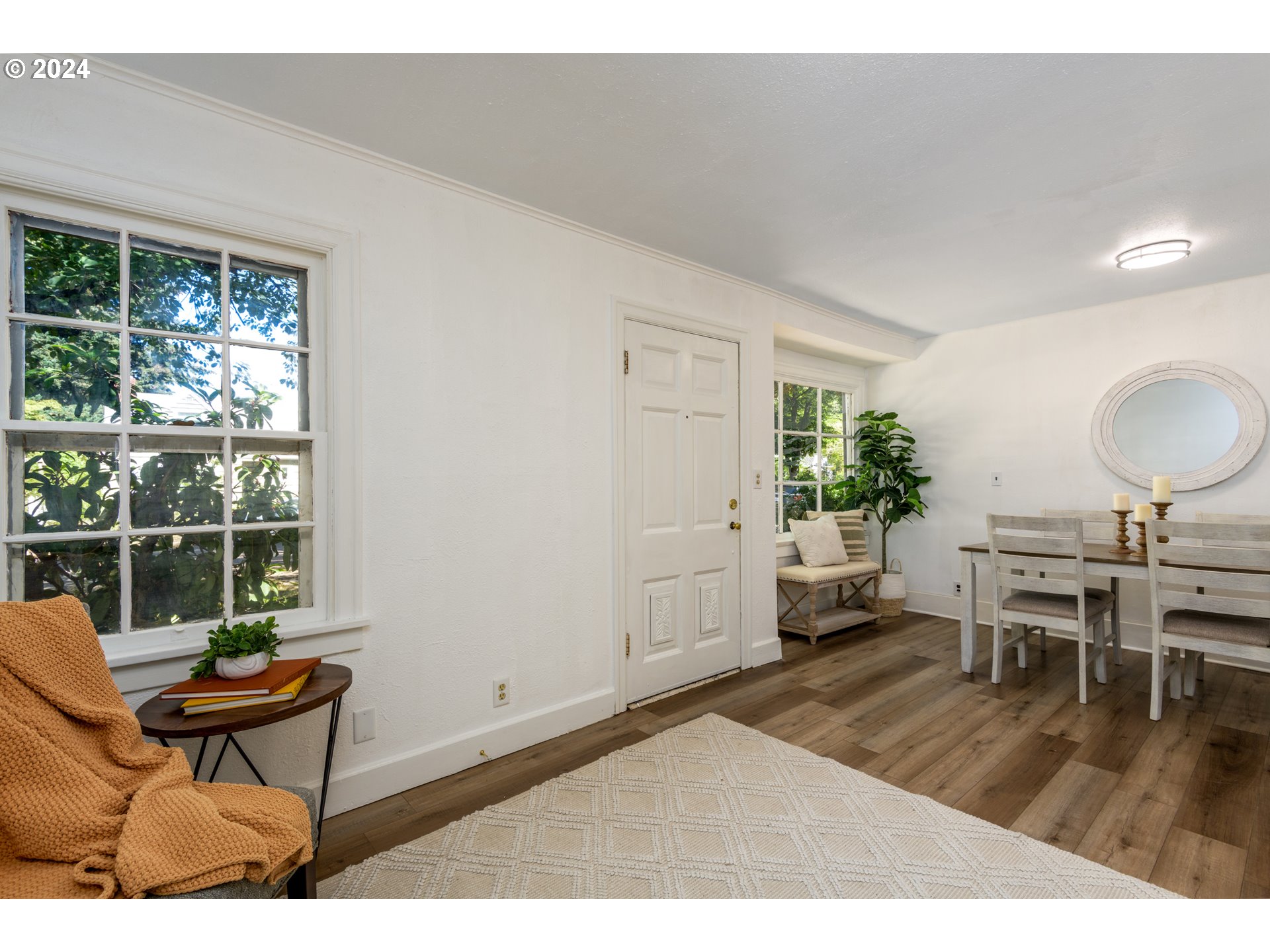 1476 West 4th Avenue Eugene, OR 97402 - Photo 6 of 26 a living room with furniture and a potted plant