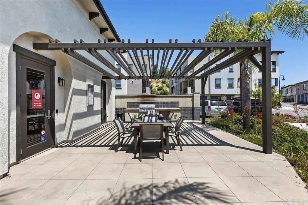2465 Solara Lane Vista, CA 92081 - Photo 46 of 48 a view of a patio with a table and chairs