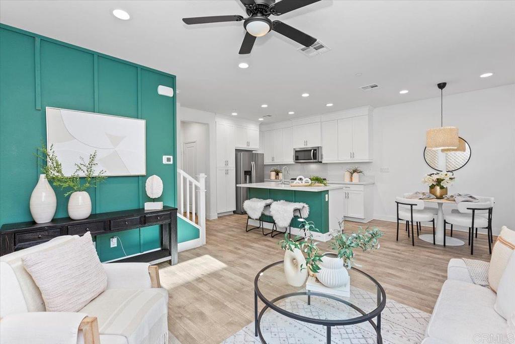 2465 Solara Lane Vista, CA 92081 - Photo 5 of 48 a living room with furniture kitchen view and a chandelier