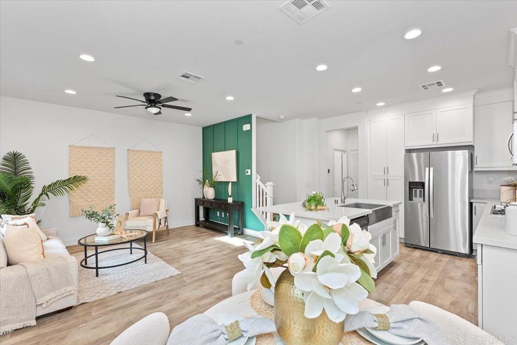 2465 Solara Lane Vista, CA 92081 - Photo 10 of 48 a living room with furniture and a large window