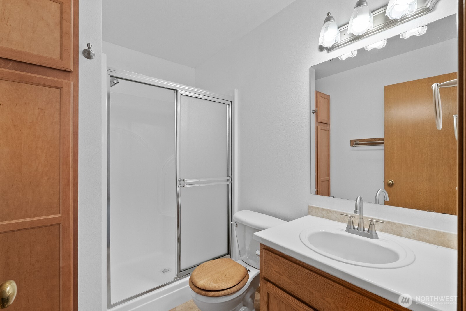 215 James Street Roy, WA 98580 - Photo 12 of 26 a bathroom with a sink a toilet and shower