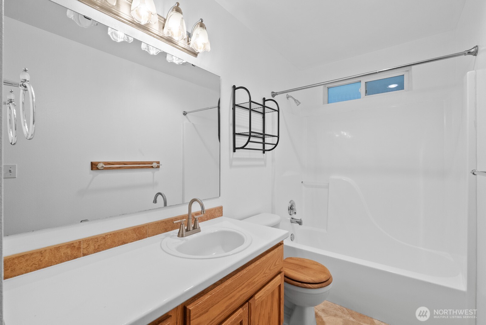 215 James Street Roy, WA 98580 - Photo 13 of 26 a bathroom with a sink a toilet and a shower