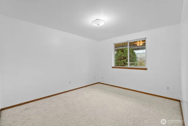 an aerial view of a house with backyard