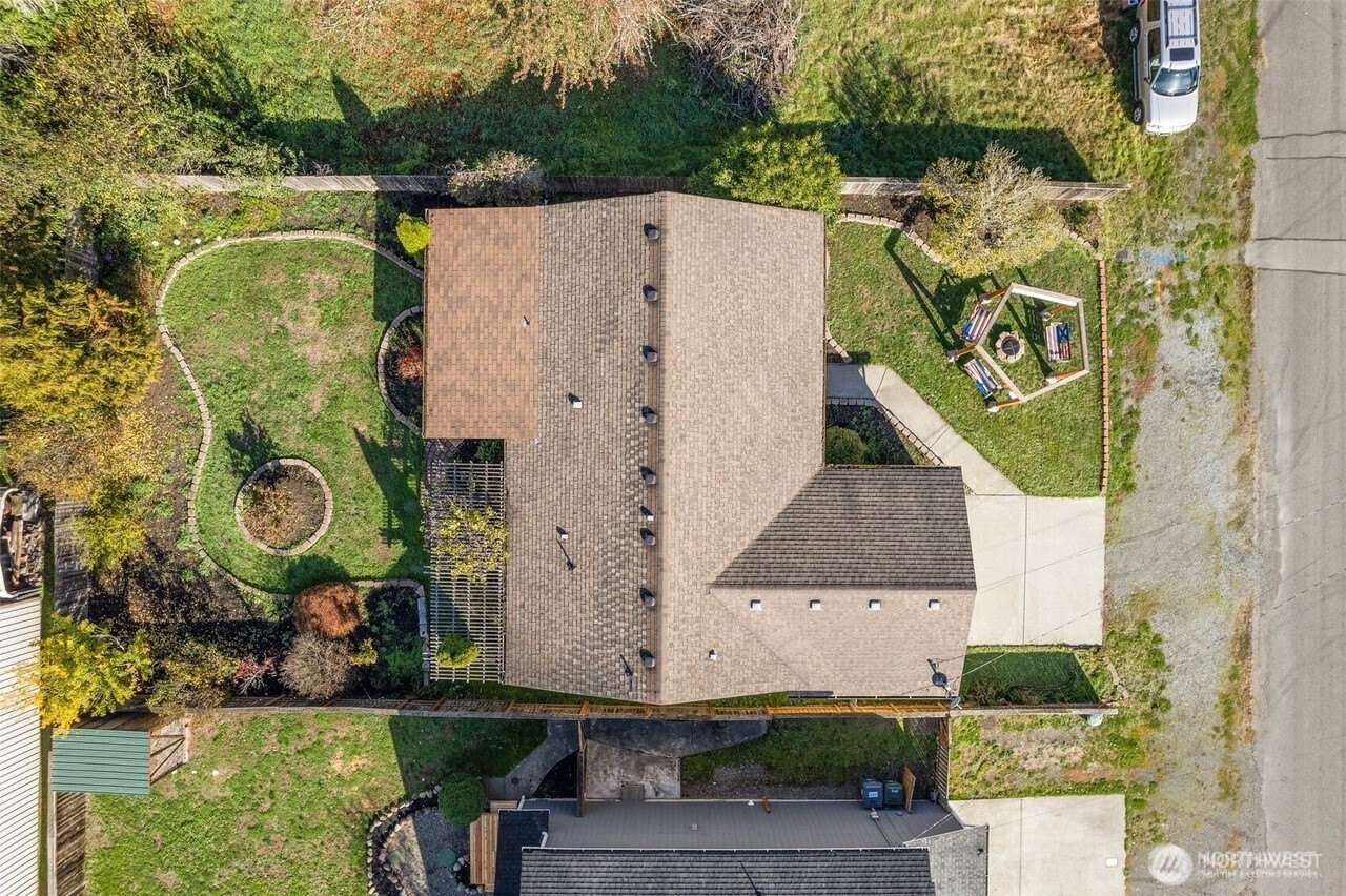 215 James Street Roy, WA 98580 - Photo 23 of 26 an aerial view of a house with a yard and large trees