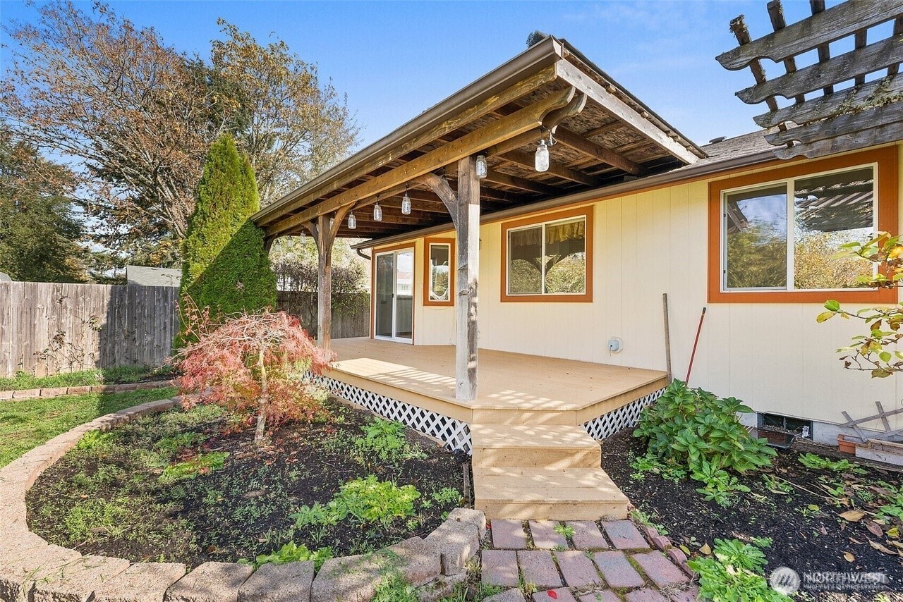 215 James Street Roy, WA 98580 - Photo 3 of 26 a front view of a house with garden