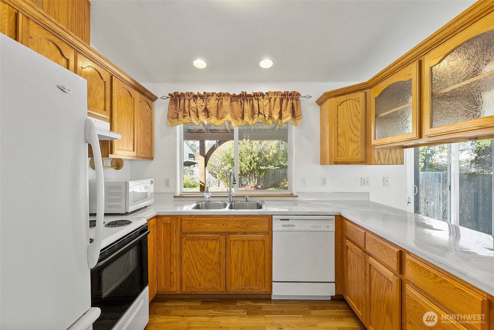 215 James Street Roy, WA 98580 - Photo 8 of 26 a kitchen with a sink stove and cabinets