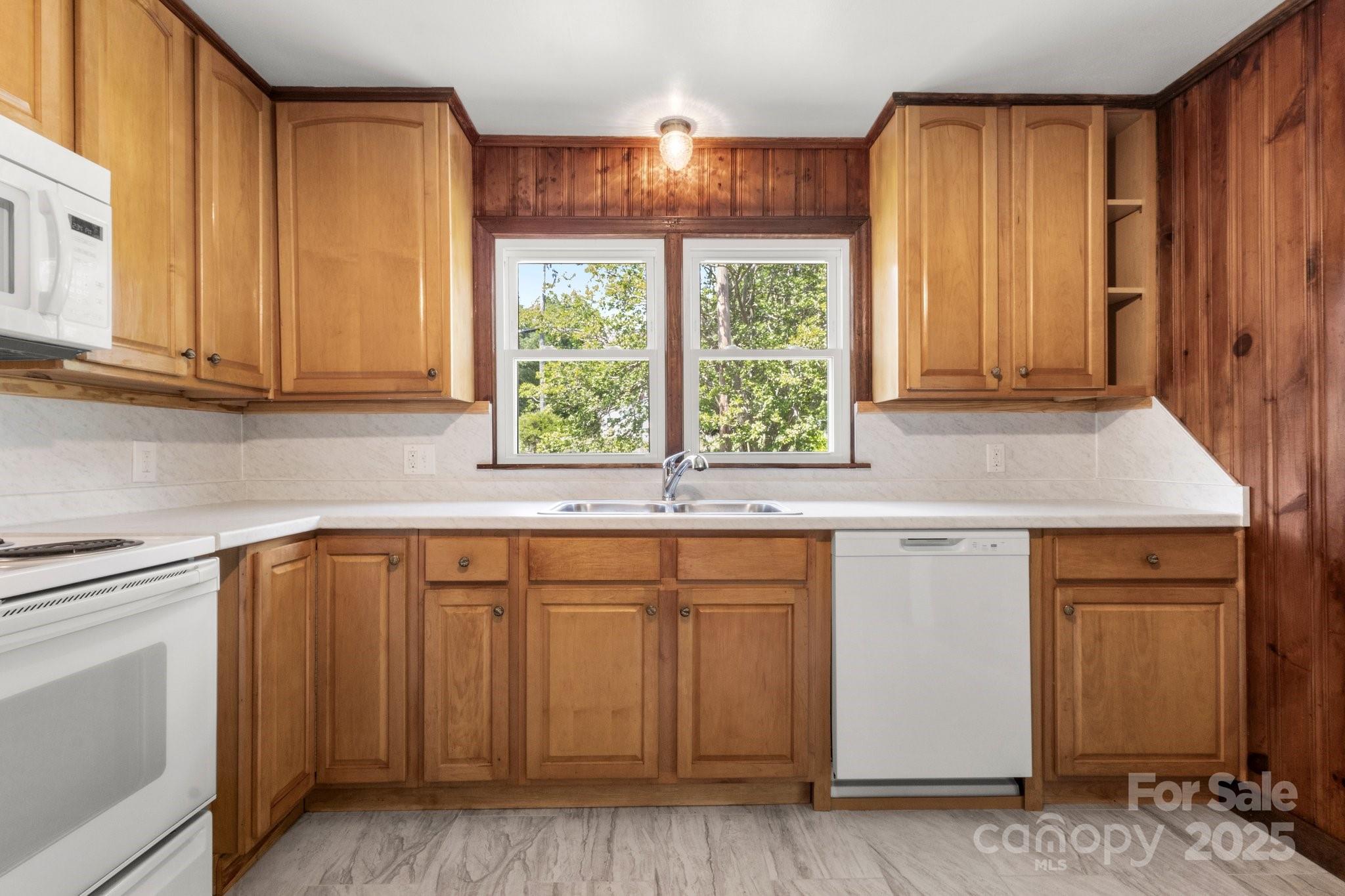 1725 Fallston Road Shelby, NC 28150 - Photo 12 of 35 a kitchen with granite countertop white cabinets and sink
