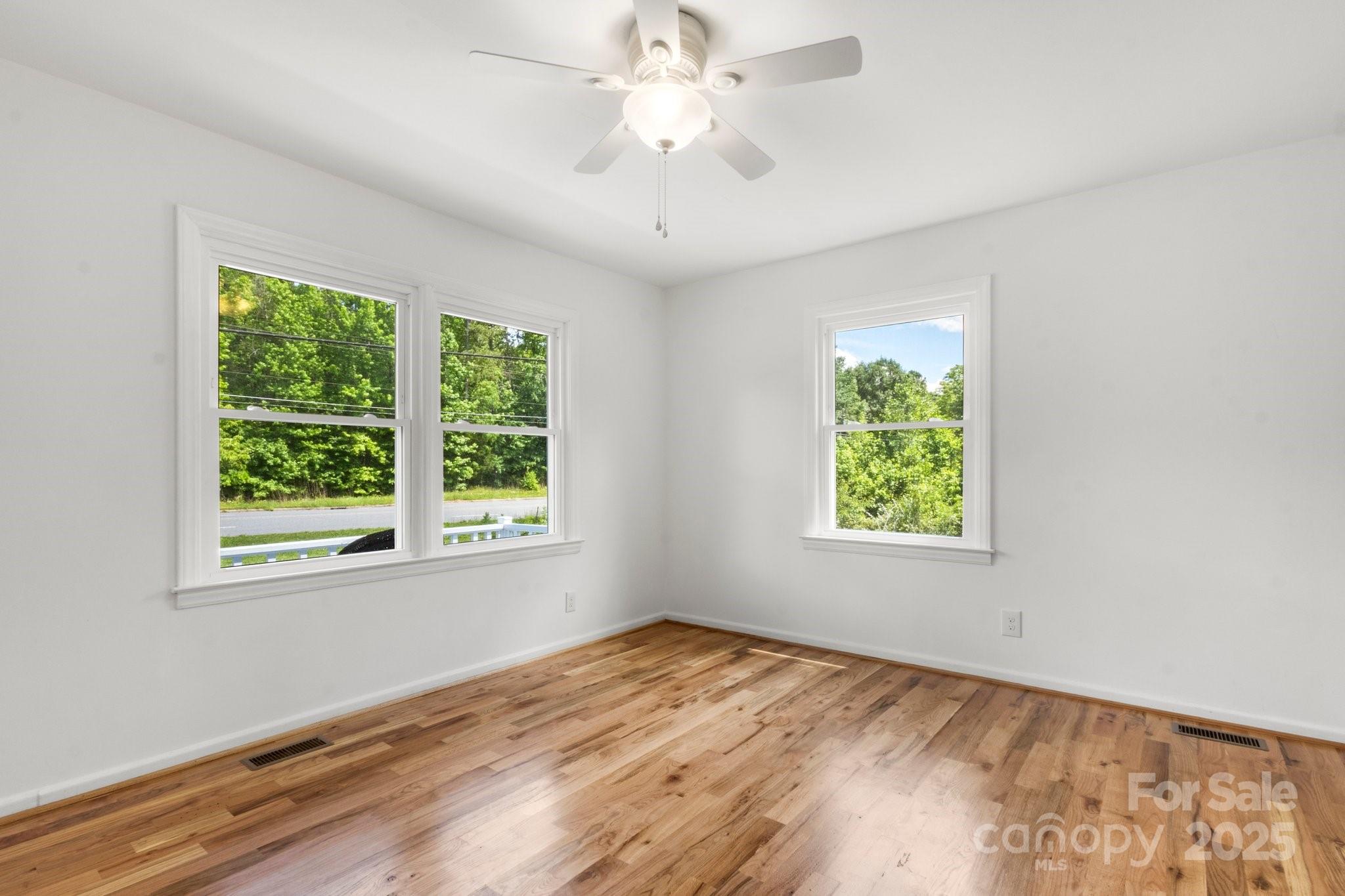 1725 Fallston Road Shelby, NC 28150 - Photo 17 of 35 a view of an empty room with wooden floor and a window