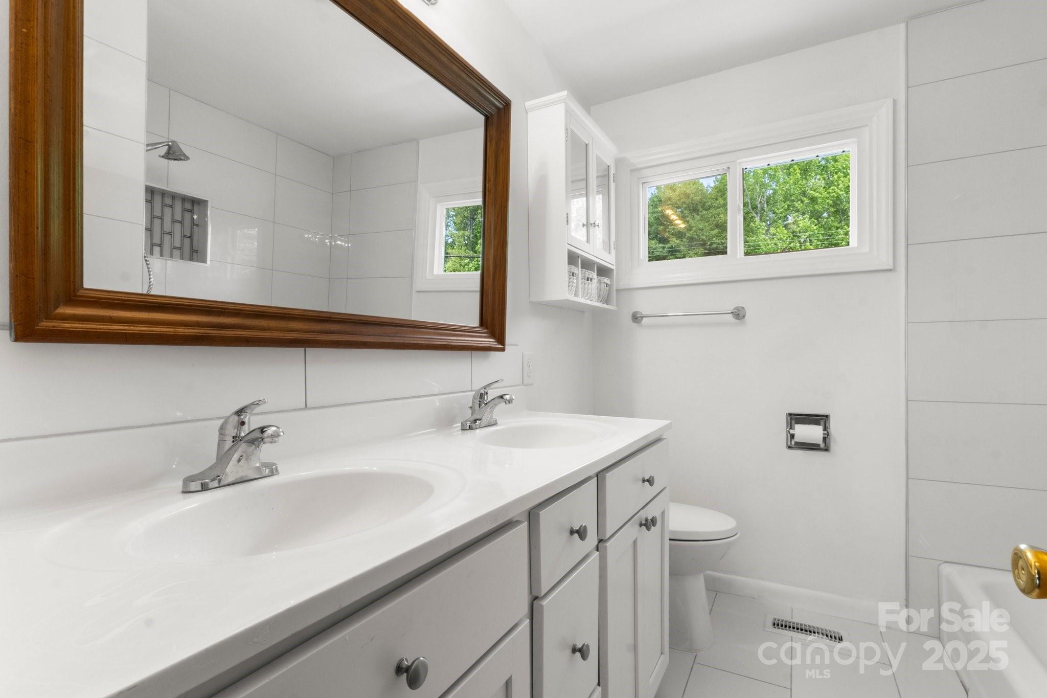 1725 Fallston Road Shelby, NC 28150 - Photo 21 of 35 a bathroom with a sink and a mirror
