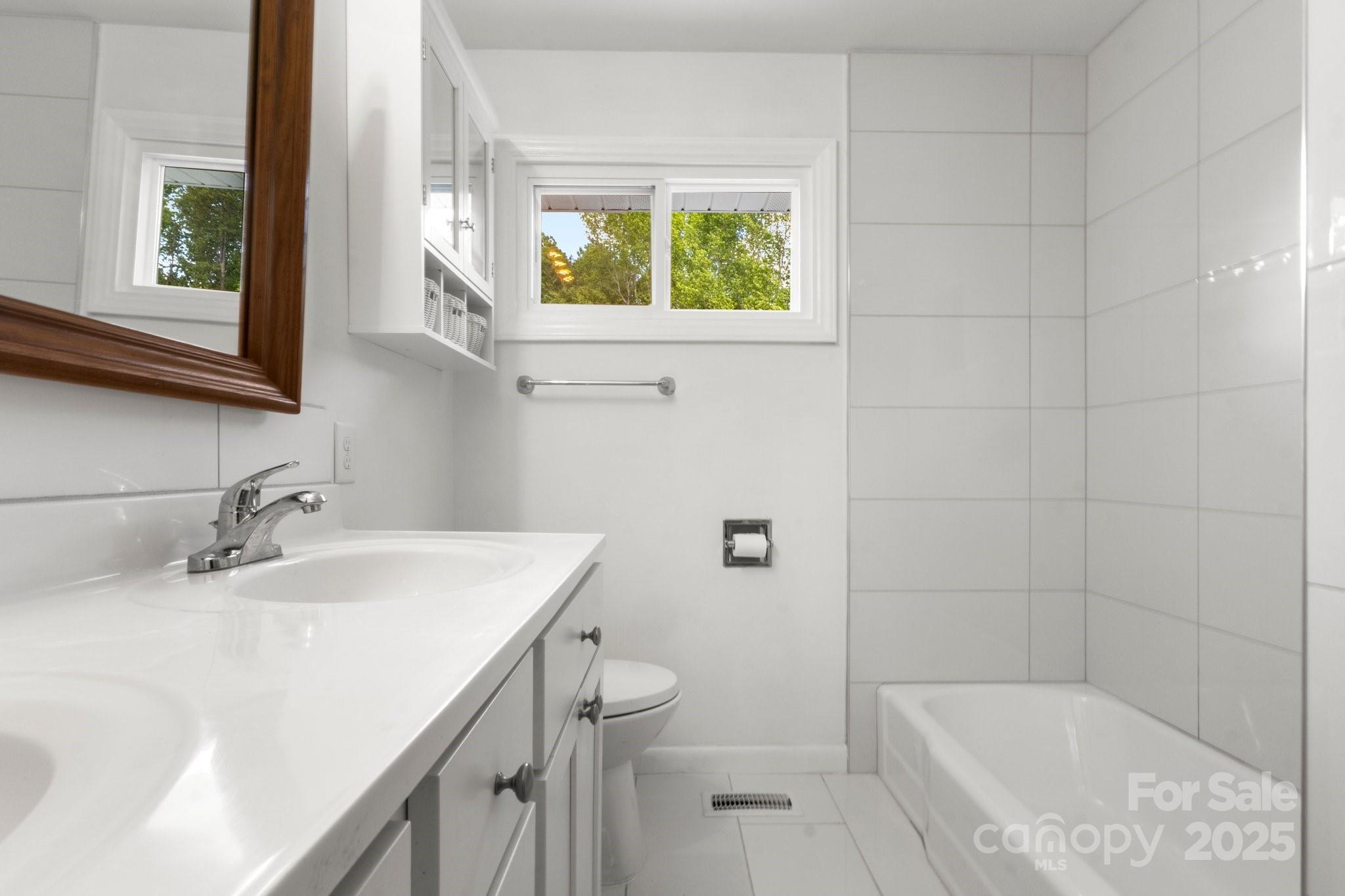 1725 Fallston Road Shelby, NC 28150 - Photo 22 of 35 a bathroom with a sink toilet and shower