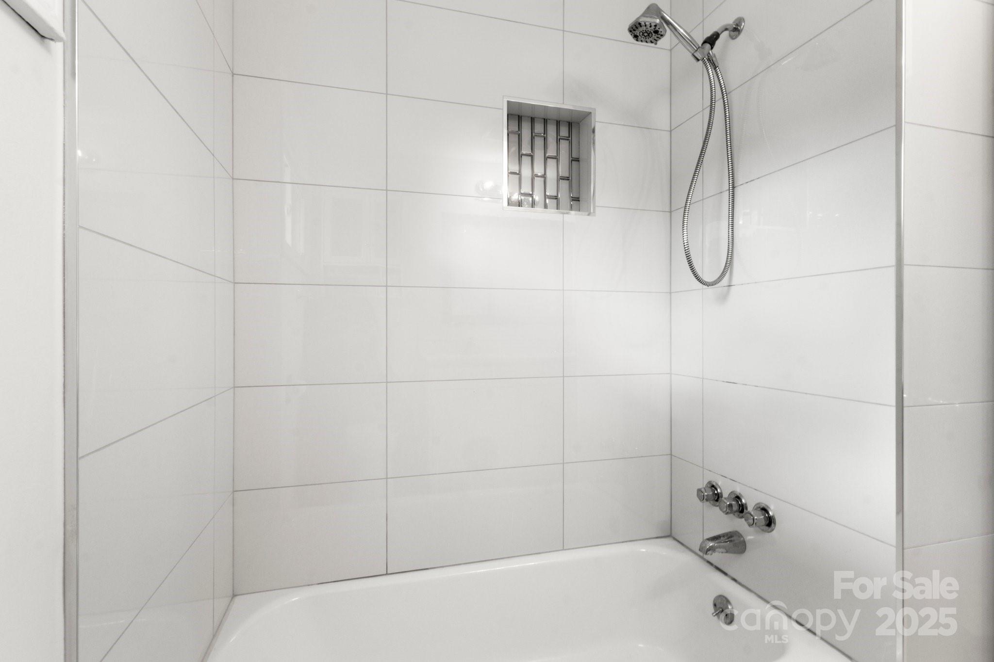 1725 Fallston Road Shelby, NC 28150 - Photo 23 of 35 a bathroom with a bath tub with a shower