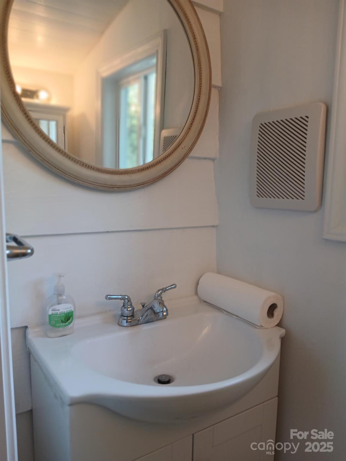 1725 Fallston Road Shelby, NC 28150 - Photo 26 of 35 a bathroom with a sink and mirror