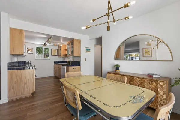 a kitchen with stainless steel appliances granite countertop a stove a refrigerator and microwave