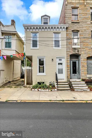a view of a building with a street