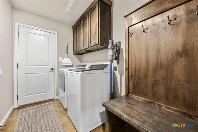 a kitchen with a refrigerator and a sink