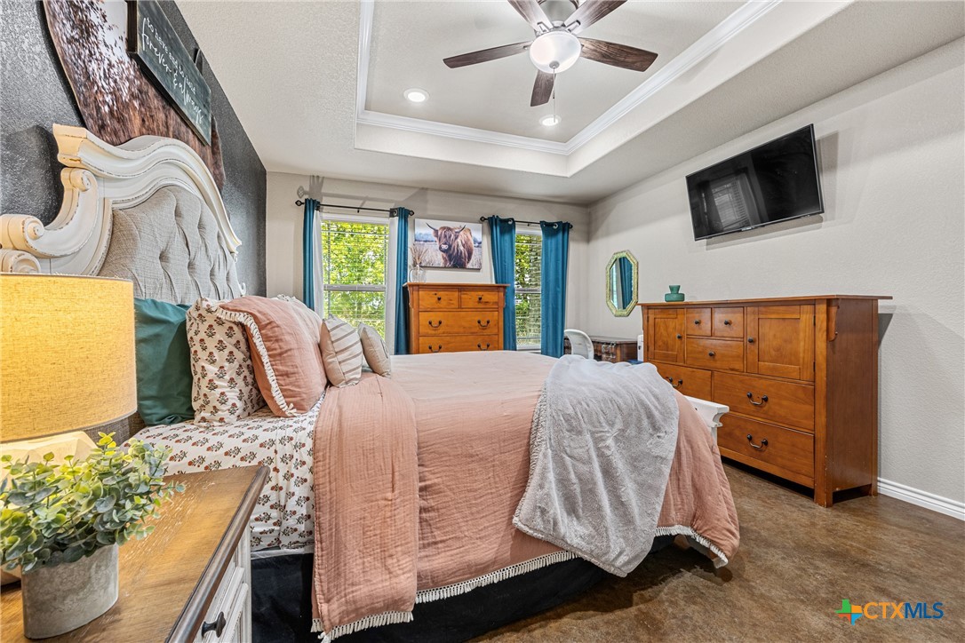 7112 Kc Ranch Court Temple, TX 76501 - Photo 18 of 30 a spacious bedroom with a bed and a flat screen tv