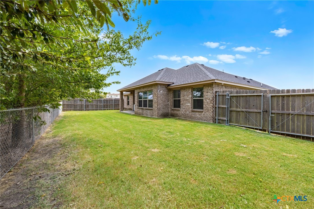 7112 Kc Ranch Court Temple, TX 76501 - Photo 26 of 30 a view of a house with a backyard and a garden