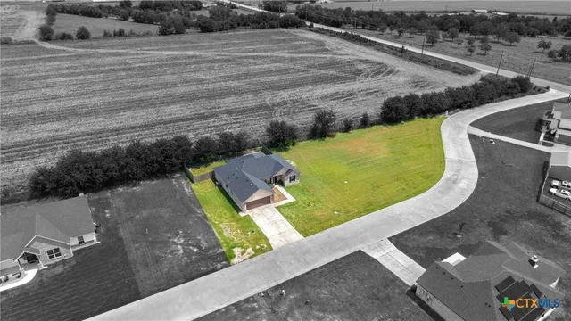 a view of a swimming pool with a yard