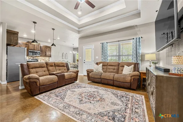 a living room with furniture and a rug