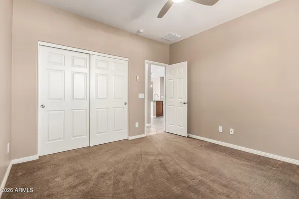 an empty room with closet area