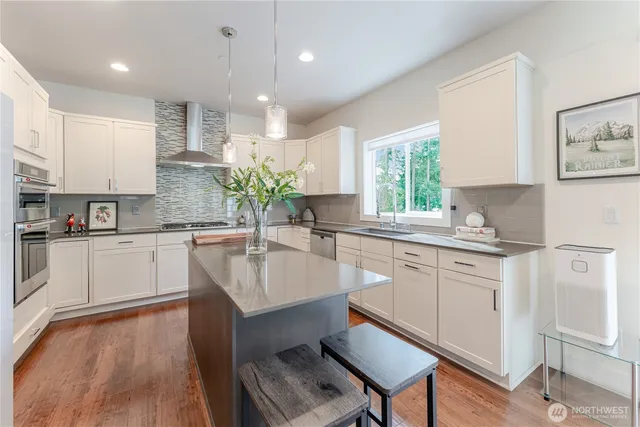 a view of deck with seating space and trees in the background