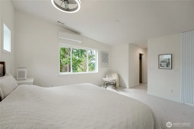 a spacious bathroom with a double vanity sink mirror and bathtub
