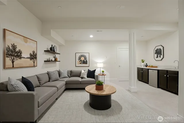 a bedroom with a bed and a potted plant on the dresser