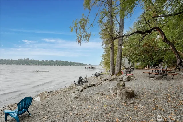 a very nice looking room with wooden floor and stairs