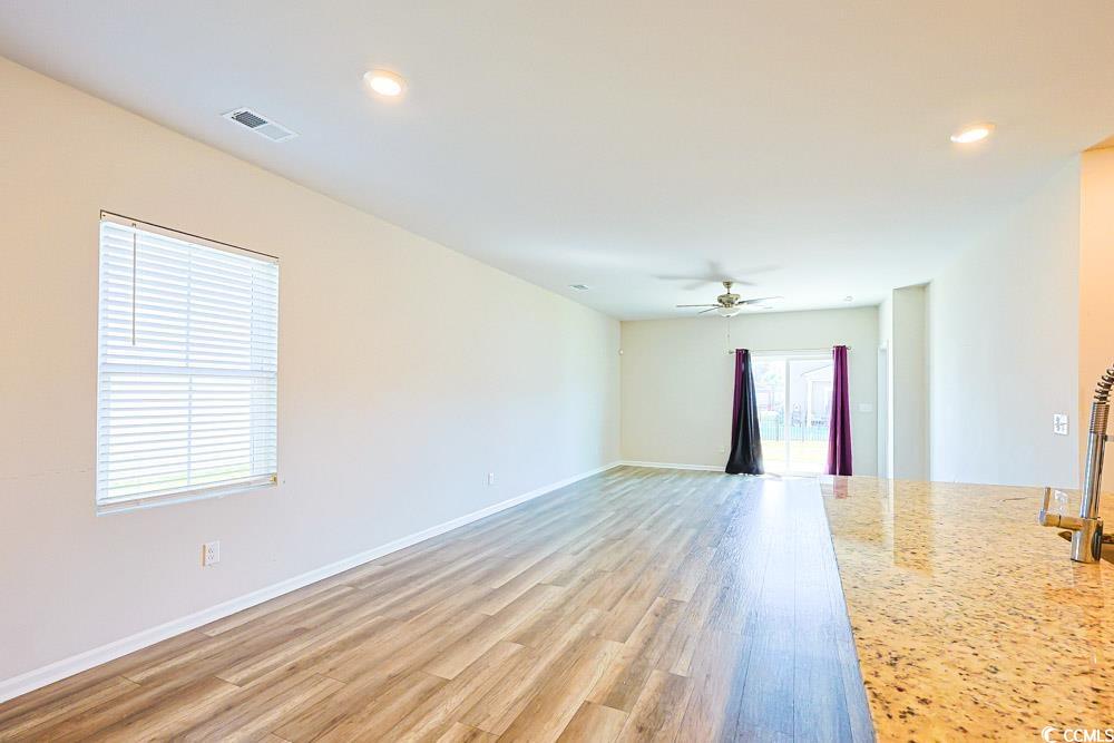1560 Swing Bridge Way Myrtle Beach, SC 29588 - Photo 2 of 35 Unfurnished room featuring recessed lighting, light wood finished floors, and ceiling fan
