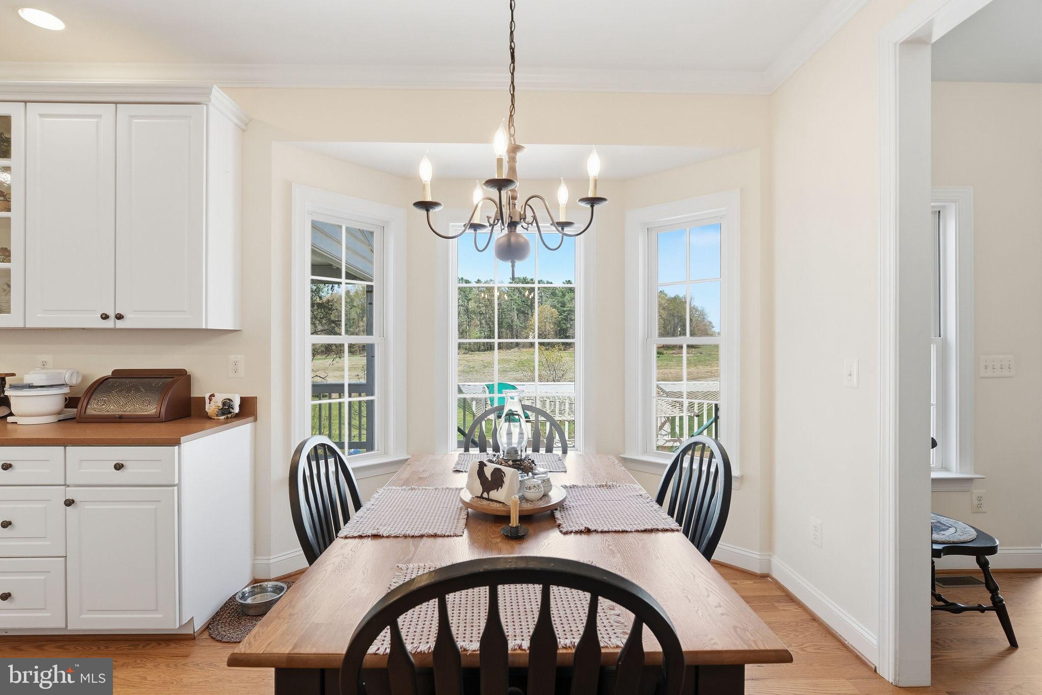 140 Woods Ridge Lane Reva, VA 22735 - Photo 14 of 87 a dining room with furniture a chandelier and window