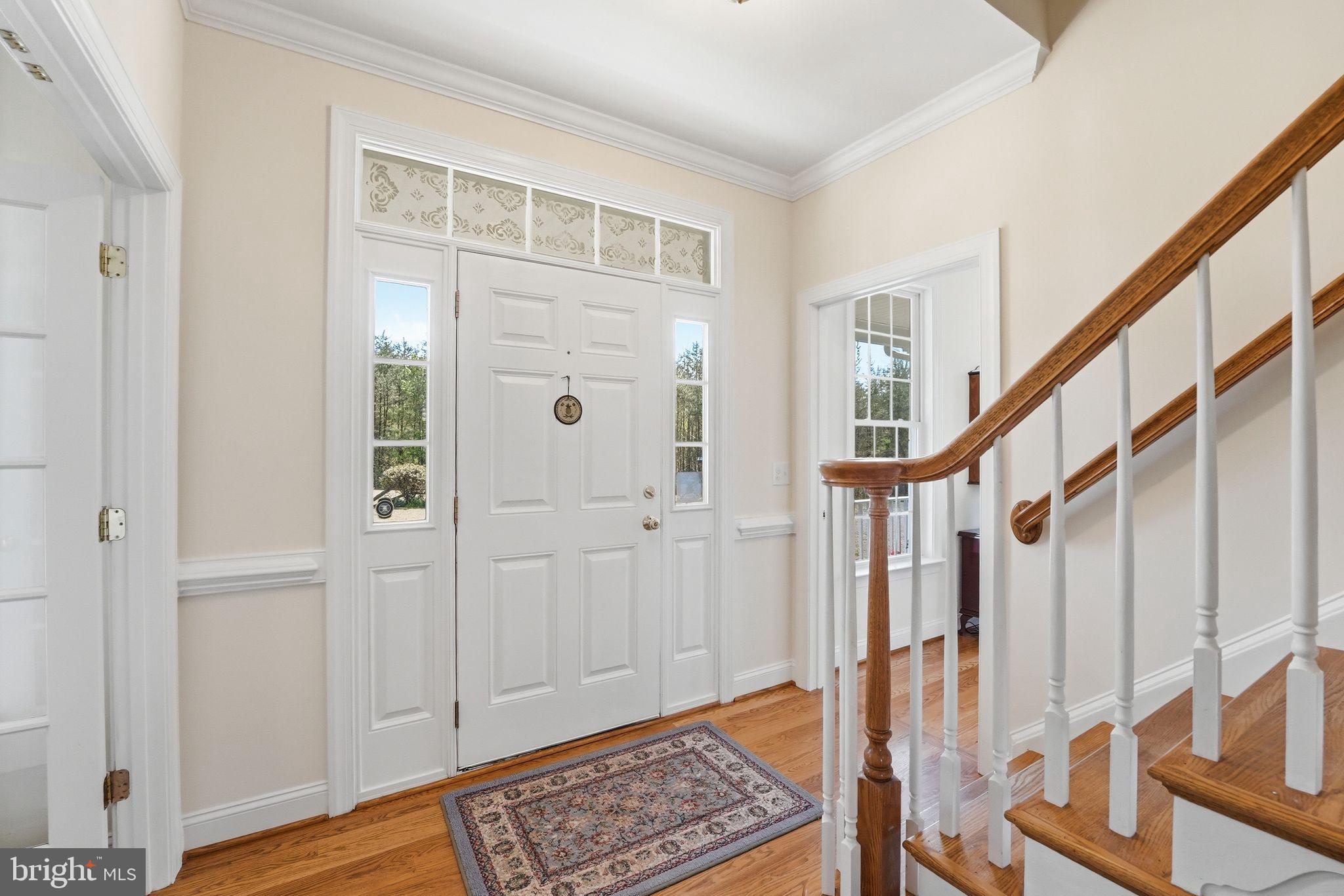 140 Woods Ridge Lane Reva, VA 22735 - Photo 15 of 87 a view of entryway with wooden floor and stairs