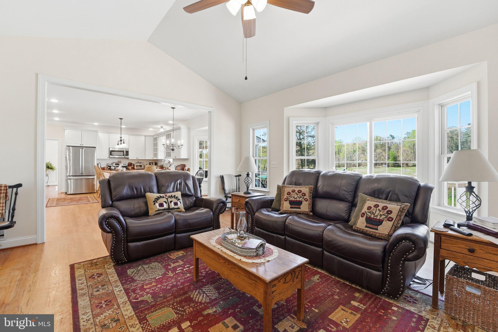 140 Woods Ridge Lane Reva, VA 22735 - Photo 19 of 87 a living room with furniture and a chandelier