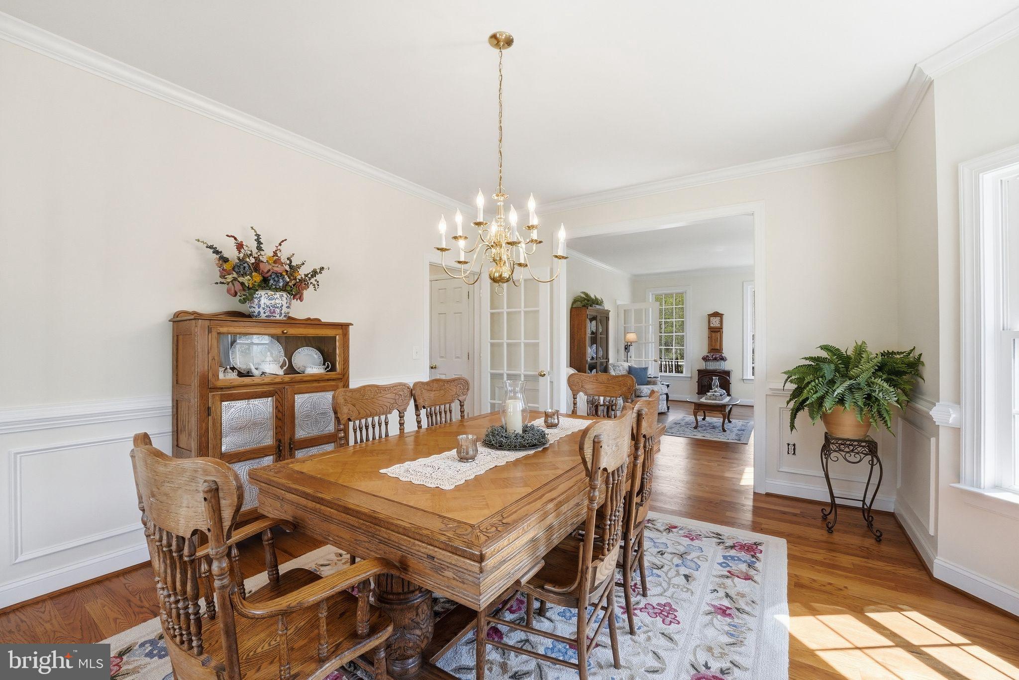 140 Woods Ridge Lane Reva, VA 22735 - Photo 27 of 87 a dining room with furniture a rug and a chandelier