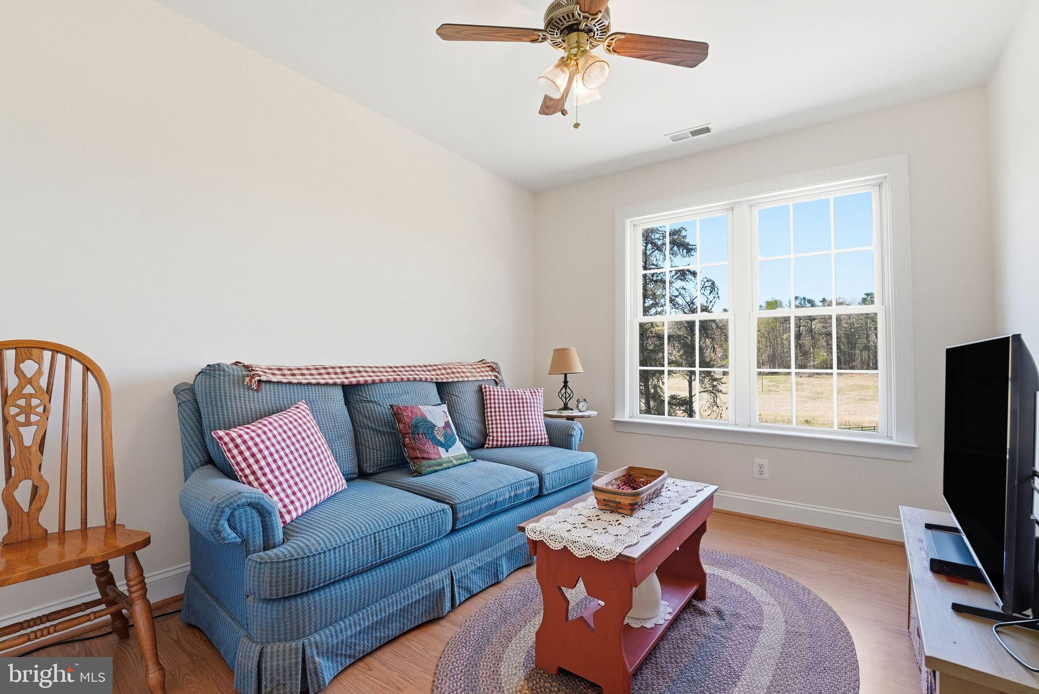 140 Woods Ridge Lane Reva, VA 22735 - Photo 31 of 87 a living room with furniture and a flat screen tv
