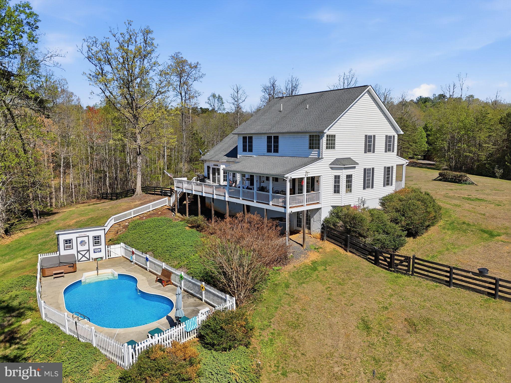 140 Woods Ridge Lane Reva, VA 22735 - Photo 4 of 87 a aerial view of a house with swimming pool and yard