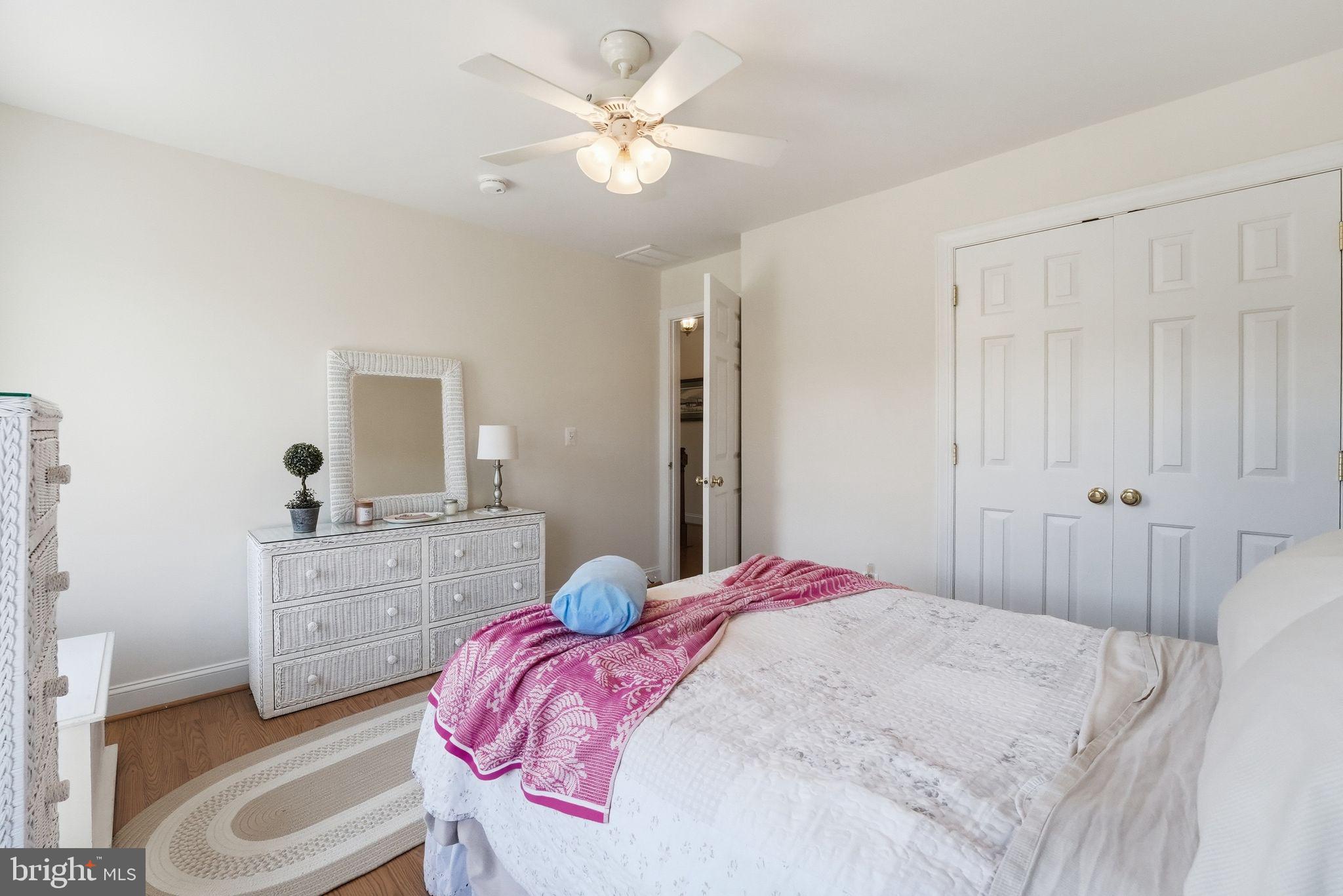 140 Woods Ridge Lane Reva, VA 22735 - Photo 43 of 87 a bedroom with a bed and a chandelier