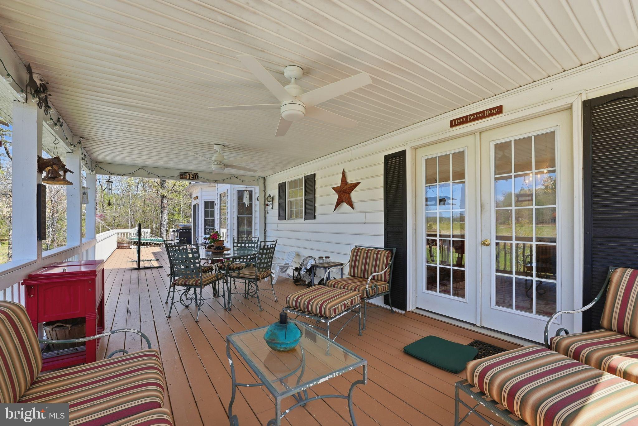 140 Woods Ridge Lane Reva, VA 22735 - Photo 50 of 87 a living room with furniture and floor to ceiling windows