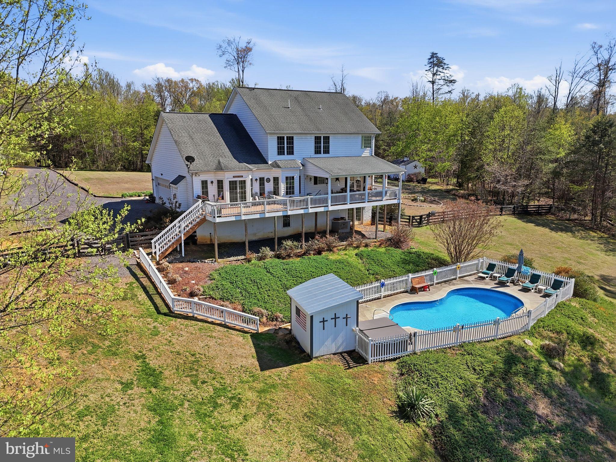 140 Woods Ridge Lane Reva, VA 22735 - Photo 58 of 87 an aerial view of a house with swimming pool patio and outdoor seating