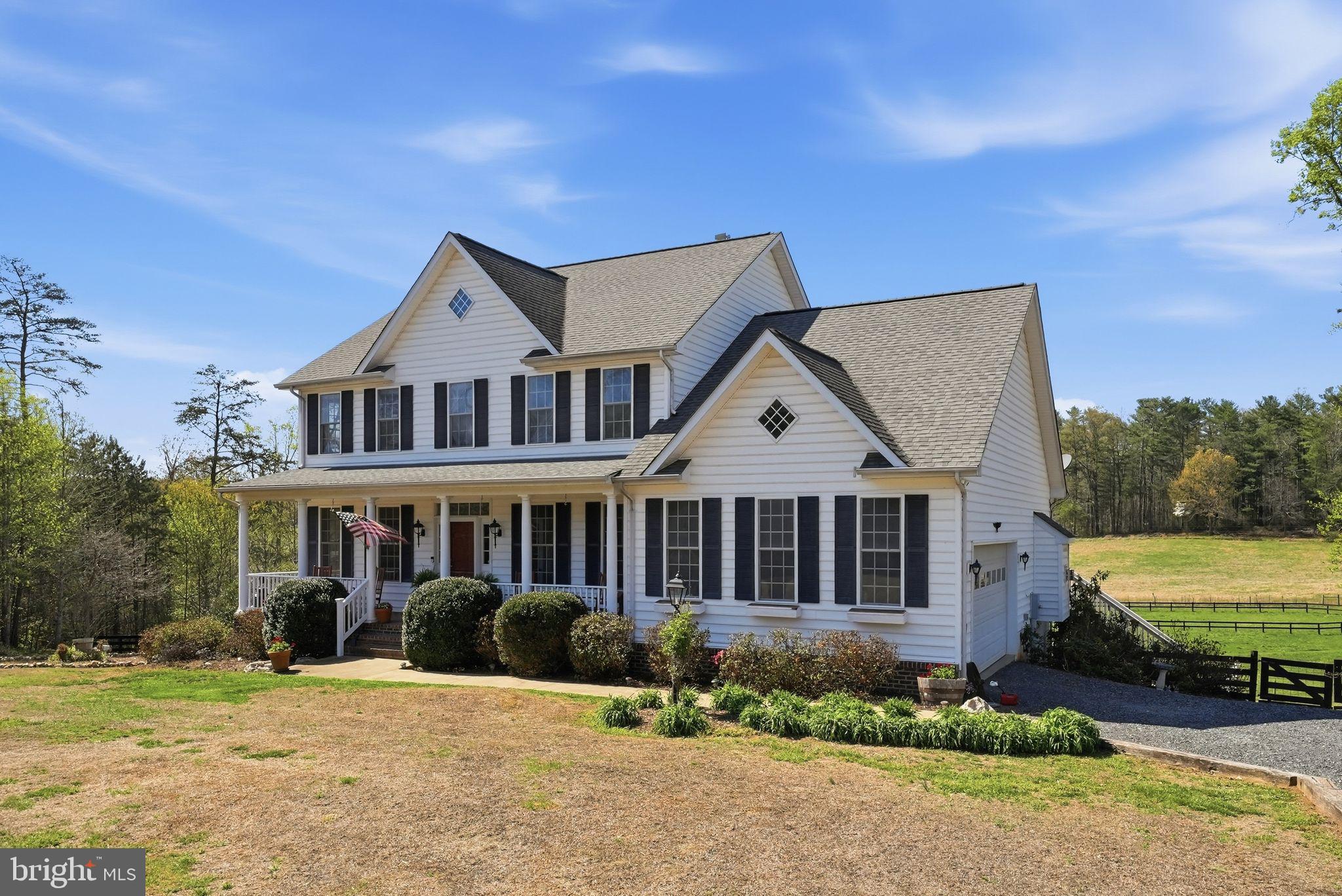 140 Woods Ridge Lane Reva, VA 22735 - Photo 6 of 87 a front view of a house with a garden