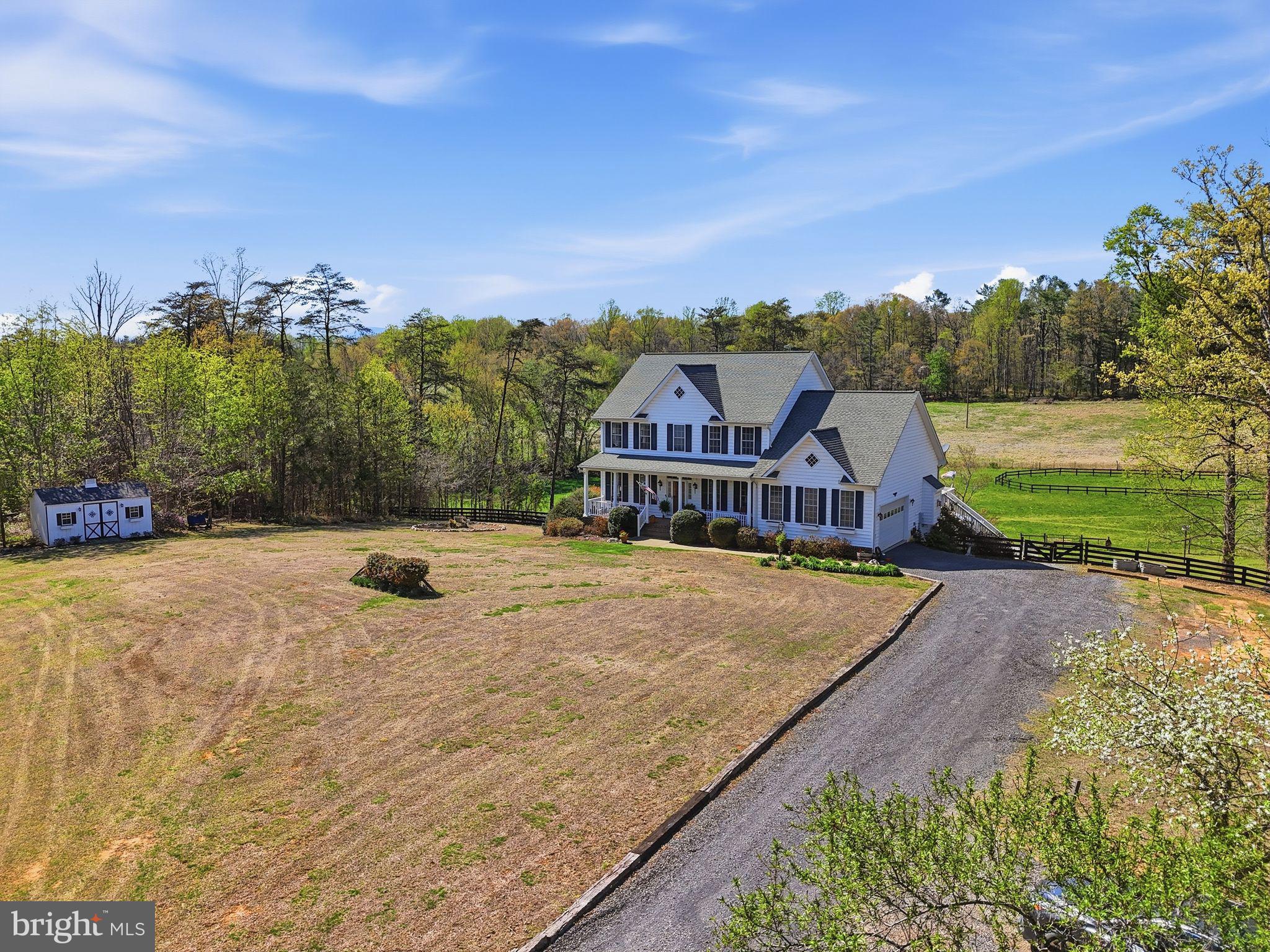 140 Woods Ridge Lane Reva, VA 22735 - Photo 83 of 87 a view of a big house with a big yard and large trees