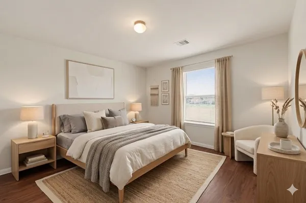 a bedroom with a bed and a couch