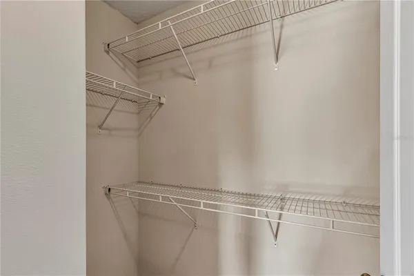 a view of a room with racks on the wall
