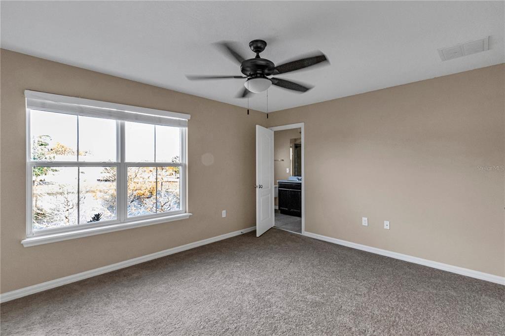 106 Carmichael Way Daytona Beach, FL 32124 - Photo 19 of 35 a view of an empty room with a window