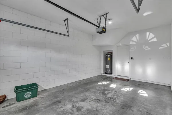 a view of a livingroom with a ceiling fan and window