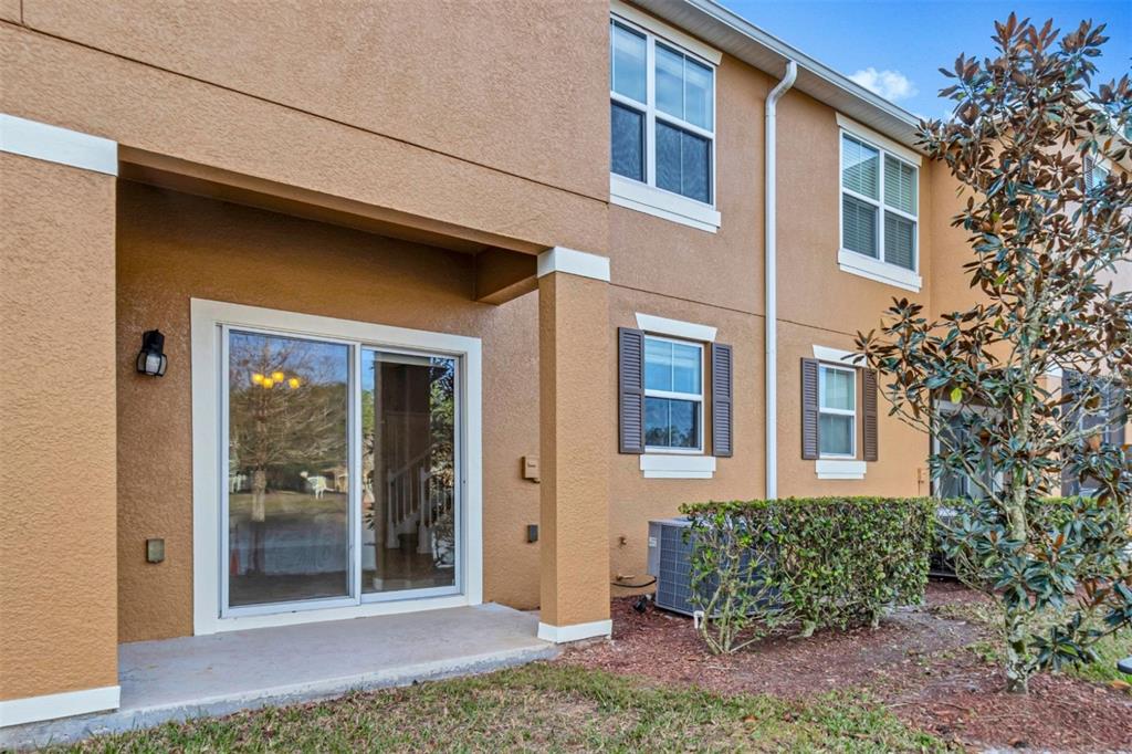 106 Carmichael Way Daytona Beach, FL 32124 - Photo 25 of 35 a view of a brick house with plants