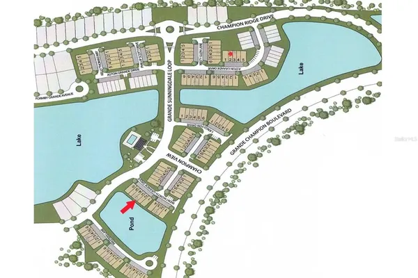 an aerial view of a house with a lake view