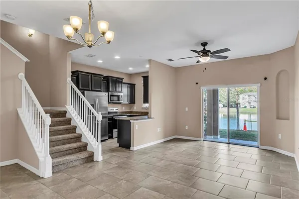 a view of entryway and kitchen