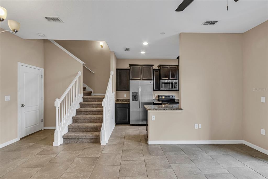 106 Carmichael Way Daytona Beach, FL 32124 - Photo 10 of 35 a view of a kitchen with a sink stove and a refrigerator