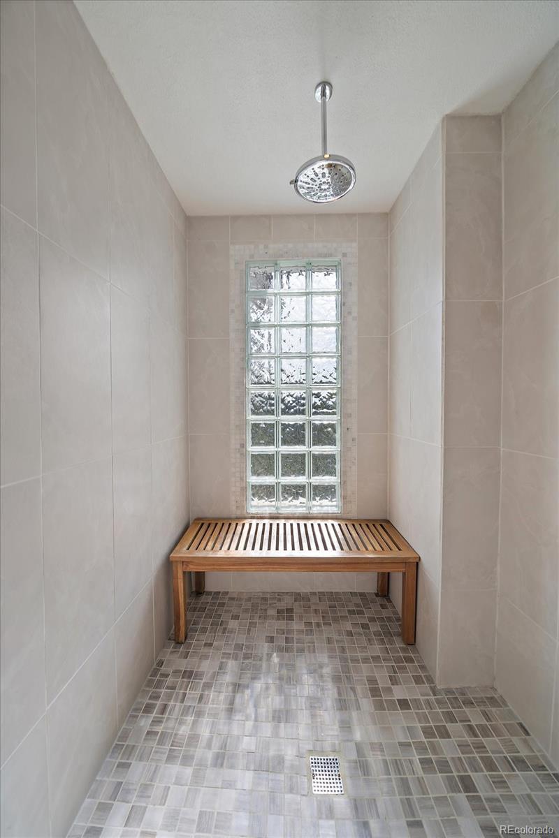 31518 Niakwa Road Evergreen, CO 80439 - Photo 22 of 48 a view of a room with stairs and windows