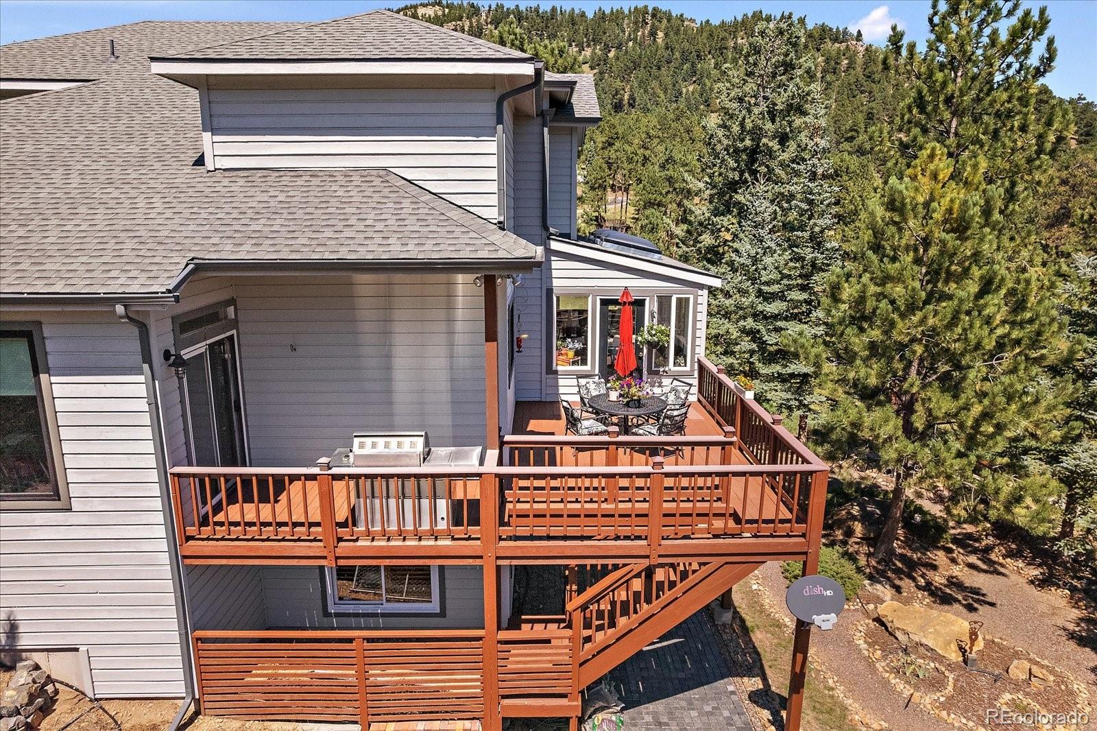 31518 Niakwa Road Evergreen, CO 80439 - Photo 33 of 48 a view of a house with large windows